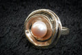 Faux pearl floral ring detail photograph