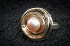 Faux pearl floral ring detail photograph