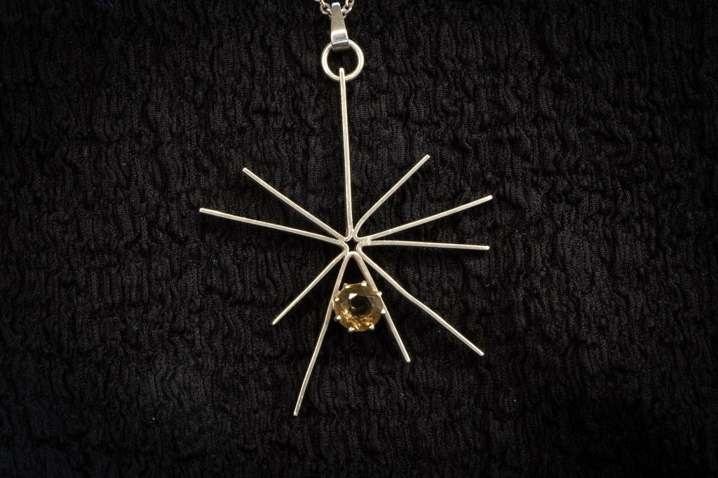 Starburst necklace detail photograph