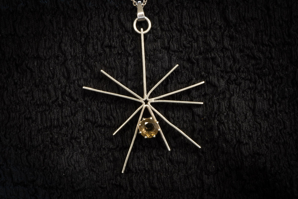 Starburst necklace detail photograph