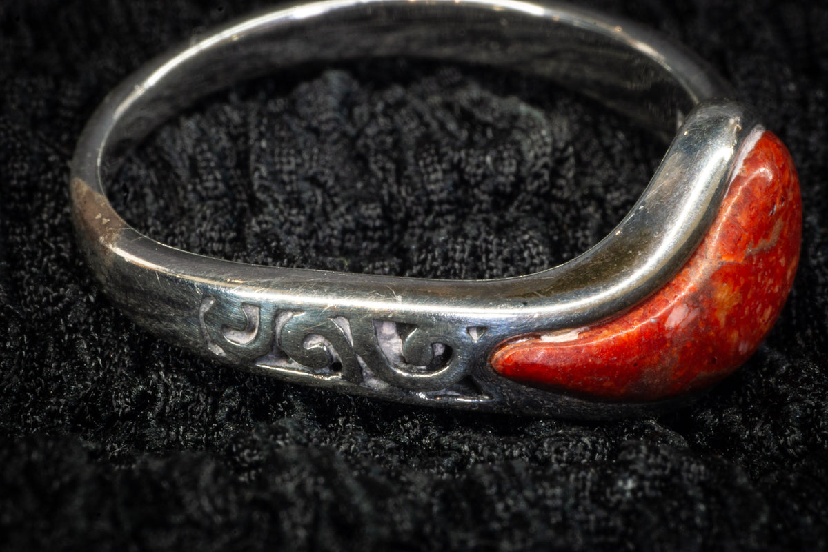 Red teardrop ring detail photograph