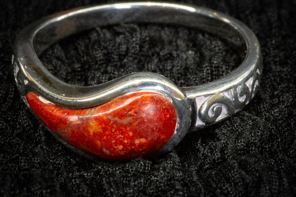 Red teardrop ring detail photograph