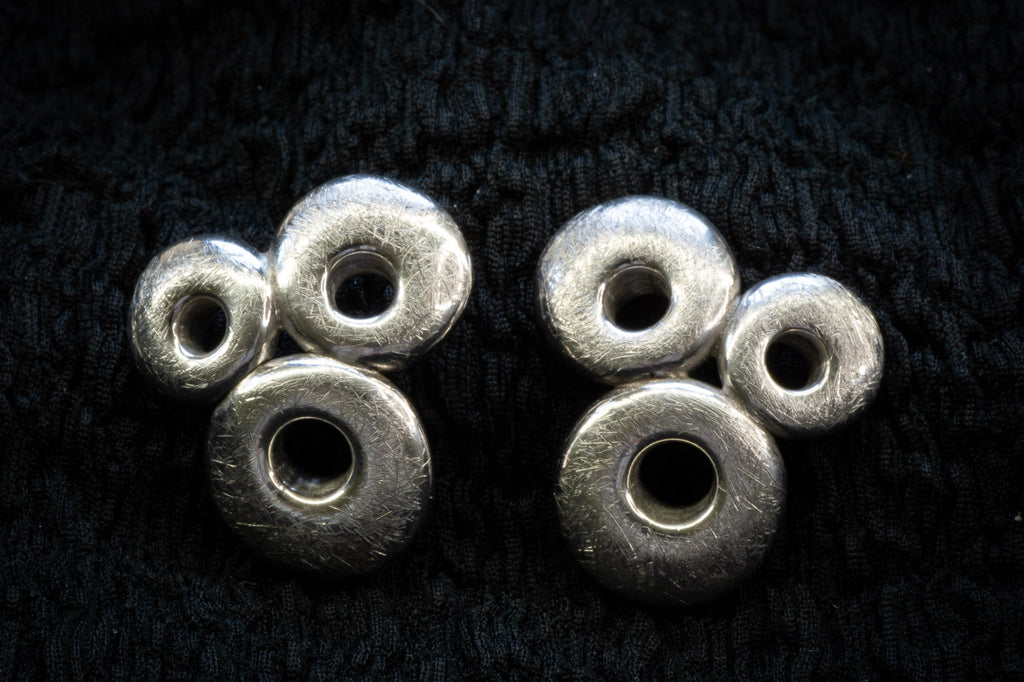 Circle brutalist studs detail photograph