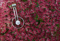 Drop encircled CZ pendant editorial photograph