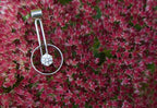 Drop encircled CZ pendant editorial photograph