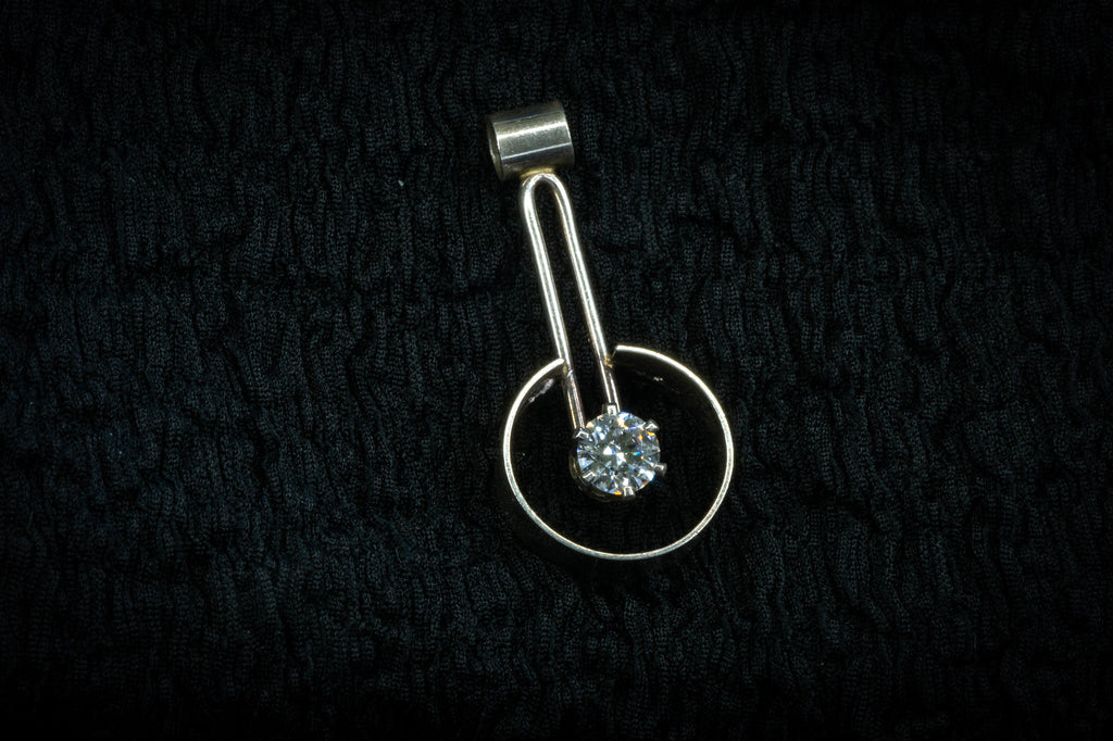 Drop encircled CZ pendant detail photograph