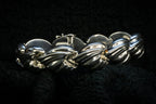 Croissant chain bracelet detail photograph