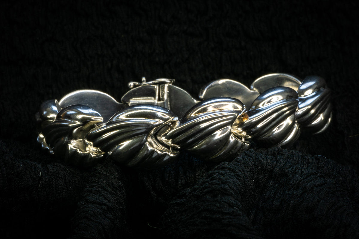 Croissant chain bracelet detail photograph