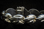 Croissant chain bracelet detail photograph
