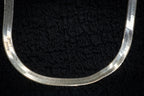 Thick strand herringbone necklace detail photograph
