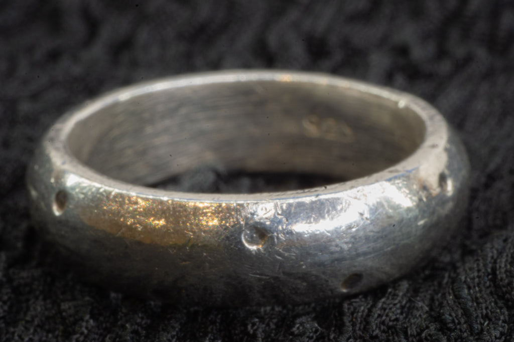 Dotted silver band detail photograph