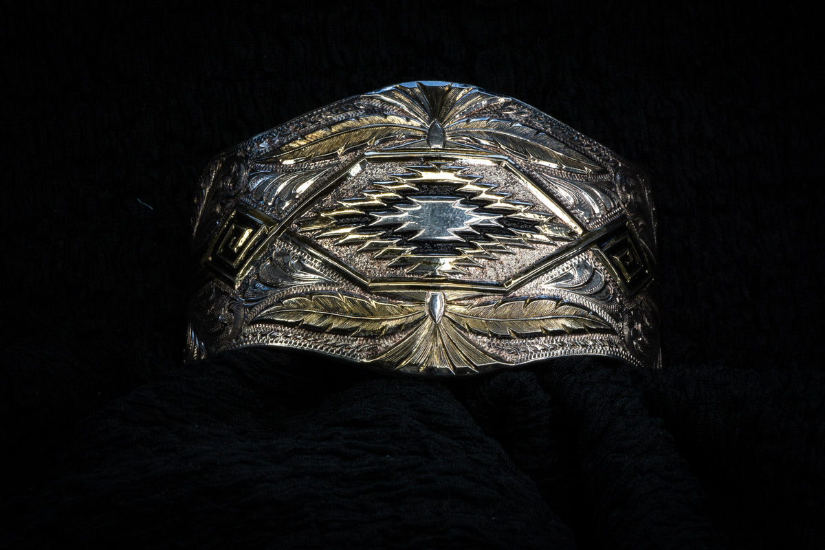Western curved studs & bangle detail photograph