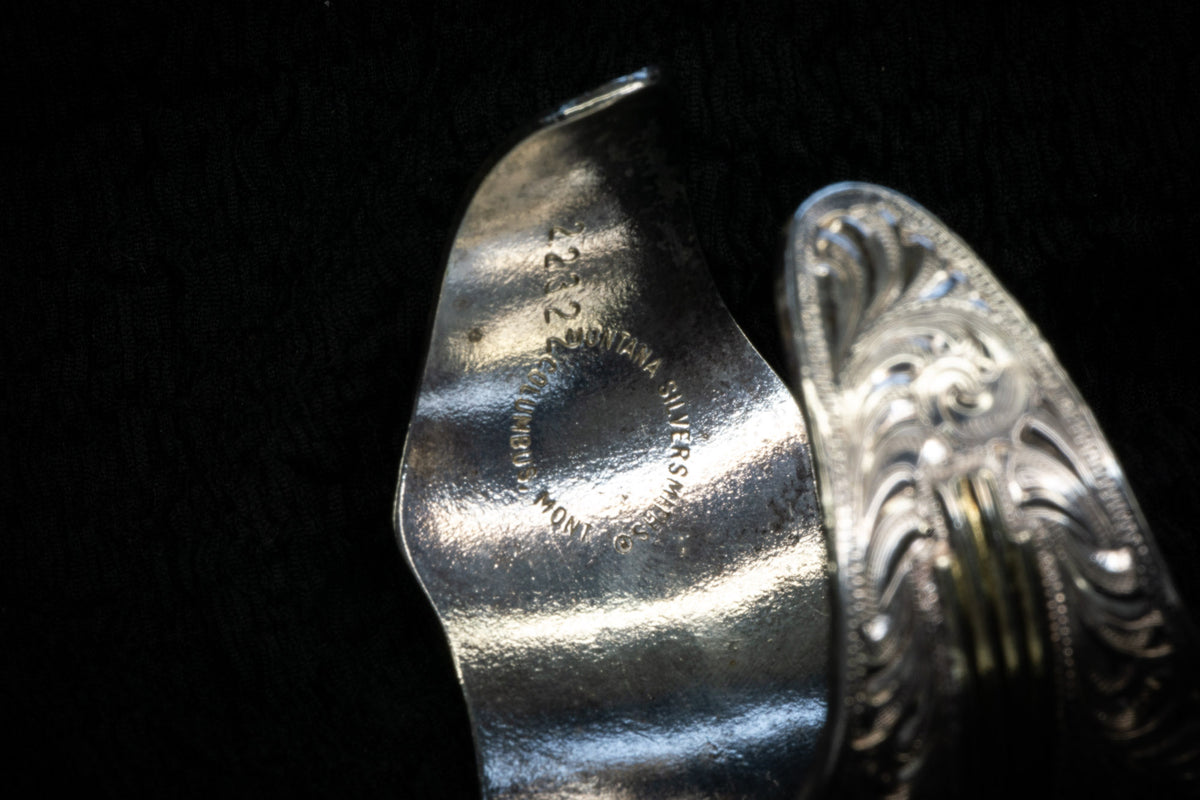 Western curved studs & bangle detail photograph