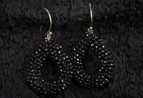 Black teardrop rhinestone dangle earrings detail photograph